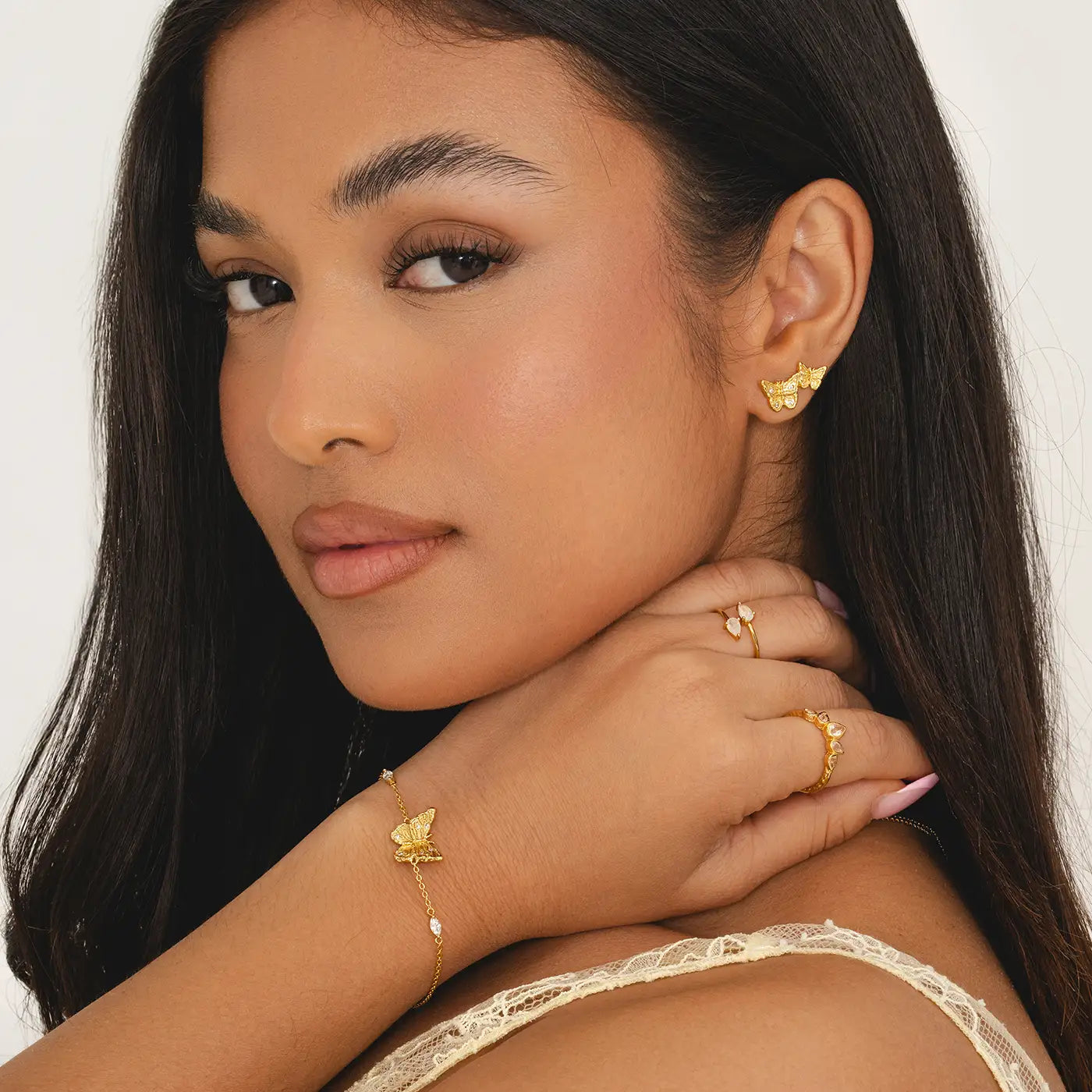 Gold butterfly wrist bracelet with filigree wing detail and cubic zirconia, nickel-free chain