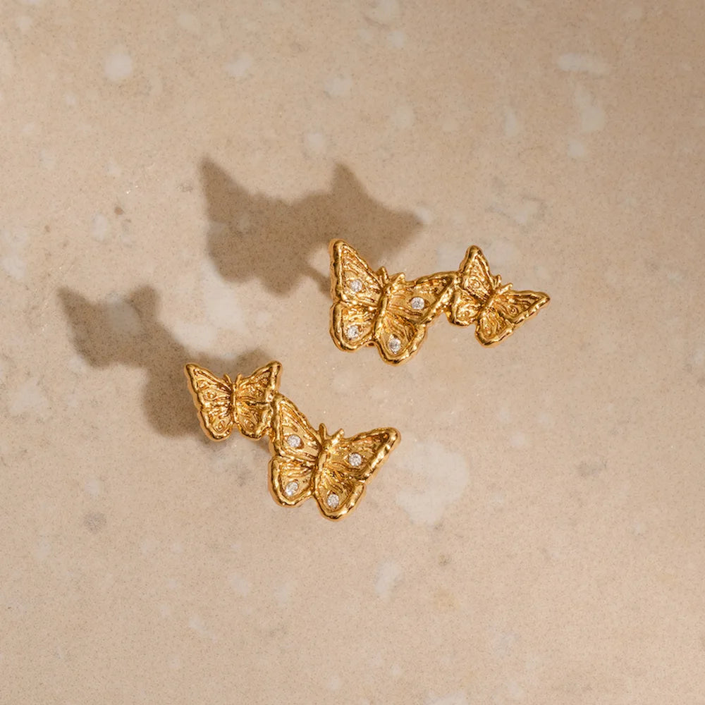 Dainty gold butterfly climber earrings front and back view, nickel-free sustainable jewellery