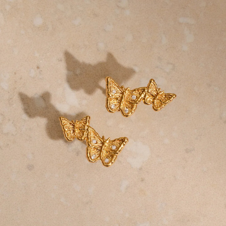 Dainty gold butterfly climber earrings front and back view, nickel-free sustainable jewellery
