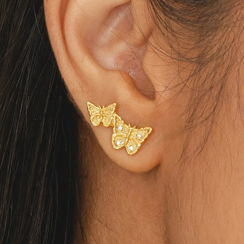 Two butterfly ascending stud earrings in 18k gold-plate with CZ accents, hypoallergenic jewellery