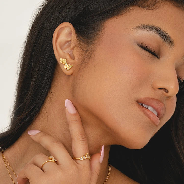 Stacked gold butterfly earrings, nickel-free climber studs with CZ stones, transformation jewellery