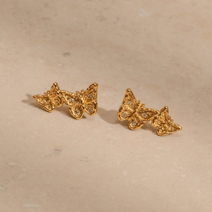 Dainty gold butterfly climber earrings front and back view, nickel-free sustainable jewellery