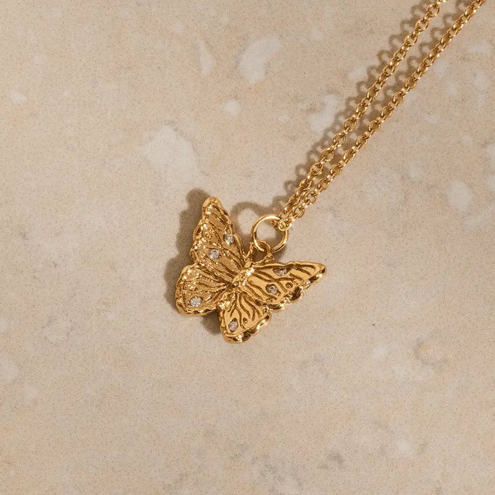 Minimalist gold butterfly pendant necklace, cubic zirconia wing detail, nickel-free ethical jewellery