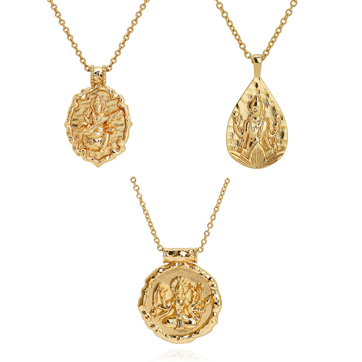 Three gold hindu goddess pendant necklaces on chains, shown against a plain white background. Goddess Saraswati, Durga and Lakshmi