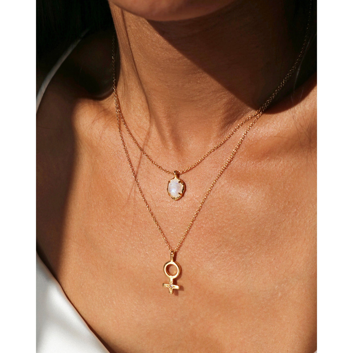 moonstone gold pendant necklace layered with female symbol necklace, Rani and co jewellery