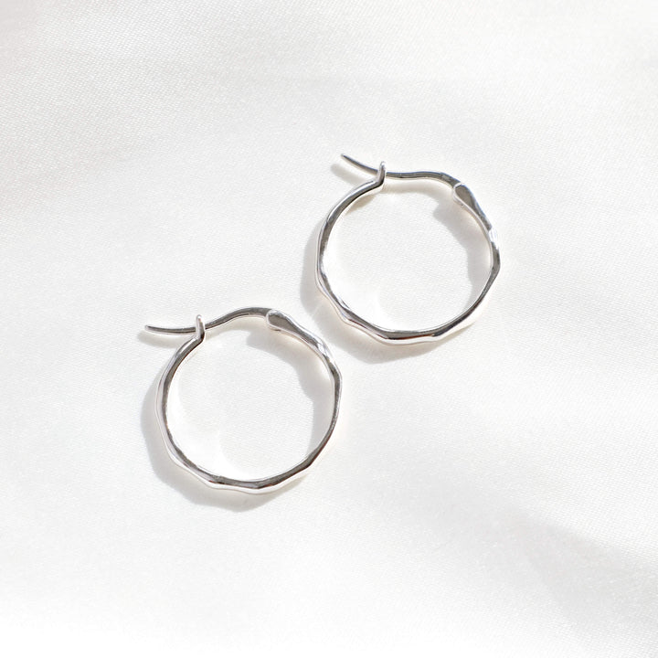 Irregular hoop earrings in silver – lightweight thin hoops for women, modern silver jewellery by Rani and Co