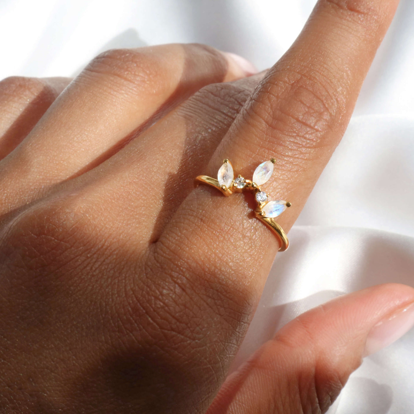 Moonstone crown ring with 2 cubic zirconia stones & 18k gold-plated band.