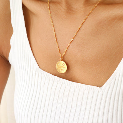 Maya Angeou feminist gold starburst necklace, Rani & Co. jewellery